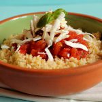 Couscous vegetariano con pomodori arrostiti e cacioricotta